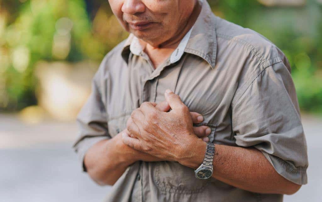 man grabbing his chest