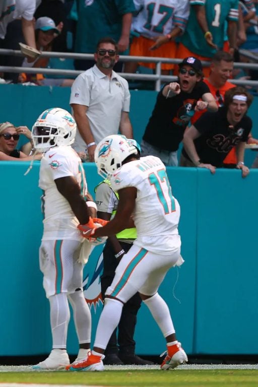 Tyreek Hill #10 of the Miami Dolphins and Jaylen Waddle #17 of the Miami Dolphins celebrate after Hill's receiving touchdown during the third quarter against the Jacksonville Jaguars at Hard Rock Stadium on September 08, 2024 in Miami Gardens, Florida. He got no speeding tickets, just a careless op charge. 