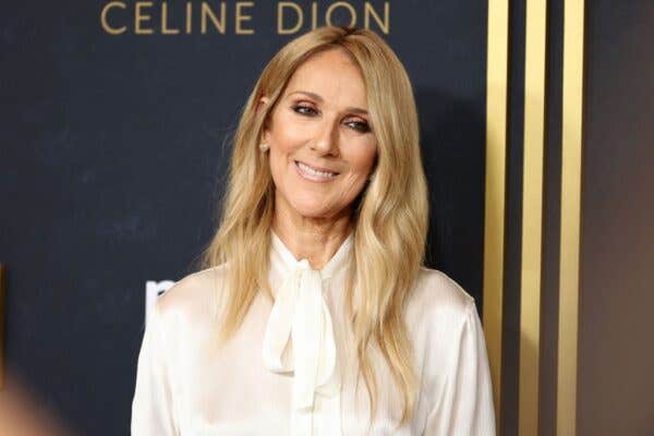 Celine Dion wearing a white blouse on the red carpet during the "I Am: Celine Dion" New York Special Screening