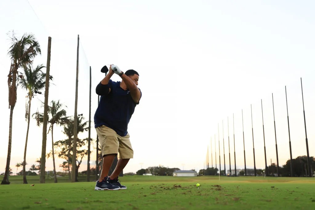 Artist DJ Khaled plays a shot on the range during Capital One's The Match IX at The Park West Palm on February 26, 2024 in West Palm Beach, Florida.