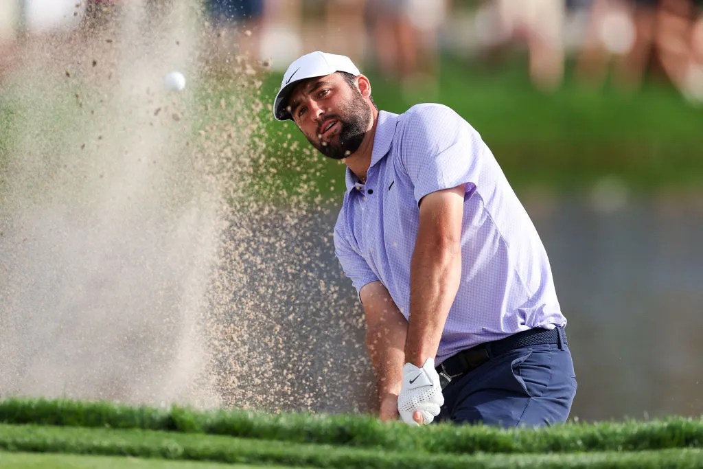 Scottie Scheffler of the United States hits out of a greenside bunker on the 17th hole during the final round of the Arnold Palmer Invitational presented by Mastercard at Arnold Palmer Bay Hill Golf Course on March 10, 2024 in Orlando, Florida. 