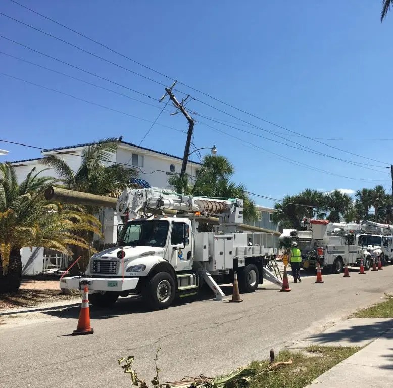 Storm restoration crews
Storm restoration crews
FPL trucks on residential street