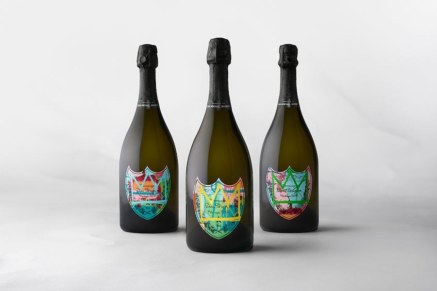 Wine gift sets of three champagne bottles with colorful labels by Dom Perignon